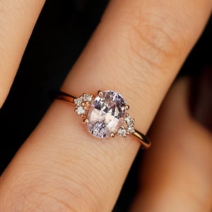 Oval pink lavender sapphire engagement ring with side diamonds, sapphire cluster ring