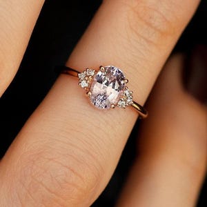 Oval pink lavender sapphire engagement ring with side diamonds, sapphire cluster ring