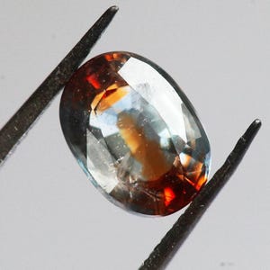 Oval loose bicolor sapphire greenish orange sapphire, red blue sapphire