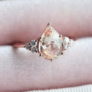 Pastel peach sapphire ring, Diamond sapphire engagement ring, Sapphire diamond ring, pear shaped engagement ring