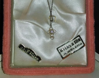 12kt Gold Filled pendant necklace. Small, delicate cross with tiny opal in the center. Vintage, in original box. Very pretty! Free Shipping!