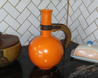 Vintage MCM tangerine orange ceramic carafe with wooden handle. Beautiful modern style! Free shipping!