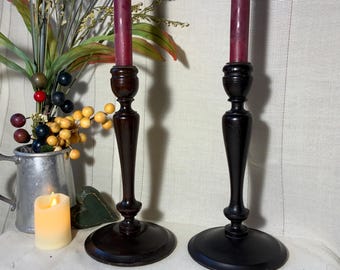 Pair of 2 beautiful vintage turned wood candlestick holders. 10” tall, 5” wide. Brass drip rings. Dark walnut/mahogany finish. Free Shipping