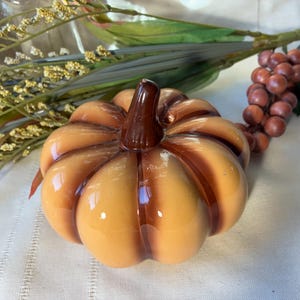 Cute ceramic decorative pumpkin figurine. Beige / brown tones. Small, 4.5 inches wide. Nice Fall or Thanksgiving decor with Free Shipping!
