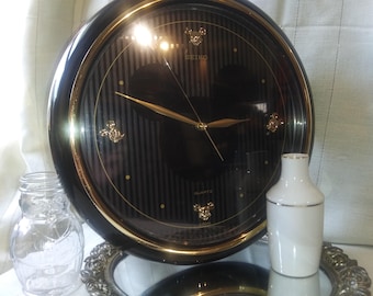 Seiko Disney wall clock, black with gold Mickey Mouse profiles. Free Shipping!