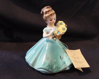 Josef Originals porcelain March birthday girl figurine with green dress, daffodils, original hang tag and stickers! Free shipping!