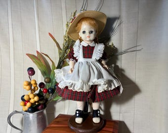 Madame Alexander  13 inch Vintage McGuffey Ana doll with doll stand, original dress, hat, and hang tag. Some sun fading. Free shipping!