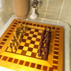Handmade solid hard wood pieced chess board with complete set of pieces. Beautifully made, with oak, walnut, and cherry. Free Shipping!