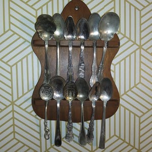 Collection of 12 antique silver plated spoons, collector and teaspoons, displayed in wooden wall hanging spoon rack. Free Shipping!