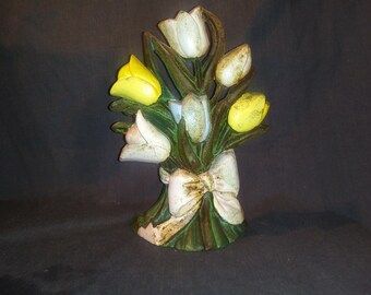 Vintage cast iron door stop in the shape of tulips. Painted green, pink, and yellow. Nice Farmhouse Decor. Includes Free Shipping!