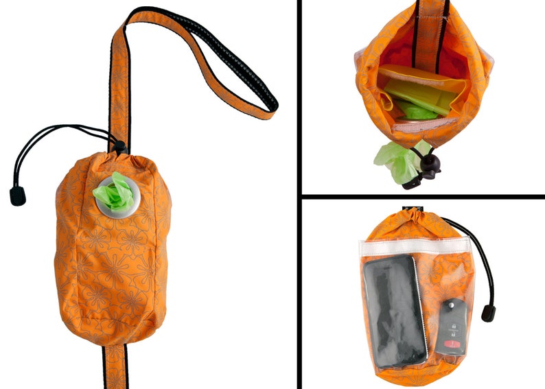 May include: Orange and white patterned bag with a drawstring closure and a clear plastic window. The bag has a strap and is designed to hold dog waste bags, a phone, and other small items.