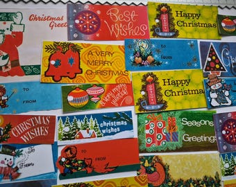 May include: A collection of vintage Christmas gift tags with various designs and text. The tags feature festive illustrations of Santa Claus, ornaments, candles, and snowmen. Text includes "Christmas Greetings," "Best Wishes," and "Happy Christmas."