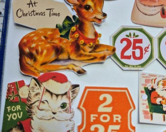 May include: A collection of vintage-style Christmas paper cutouts featuring a fawn with a bell collar, a winking kitten in a Santa hat, and price tags reading 25 cents and 2 for 35 cents, alongside a ruler showing approximately 3.5 inches.