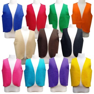 May include: A collection of eleven sleeveless vests displayed on white mannequins, featuring a variety of solid colors including blue, red, green, orange, beige, brown, black, pink, turquoise, purple, and yellow, each with a simple open front.
