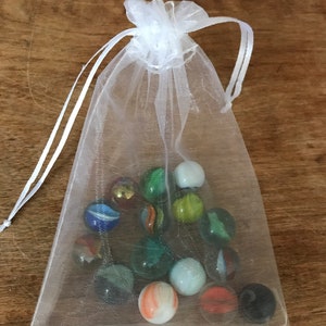 Individual bags of vintage marbles