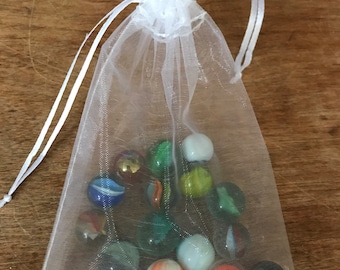 Individual bags of vintage marbles