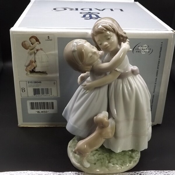 Vintage Lladro "Give Me A Hug" #8046 with box. Young sisters embracing with a puppy looking on. Completely intact! Excellent condition!