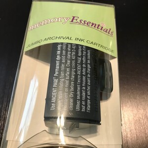 May include: A black ink cartridge for a Memory Essentials jumbo archival ink pad. The packaging says "Use Ancient Page Permanent dye ink only." and includes instructions for using the ink pad.