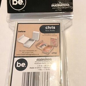 May include: A packaged craft kit featuring a small box with a magnetic closure. The packaging includes the text "chris box/boîte" and "Creative Imaginations". The kit includes instructions and examples of the finished product.
