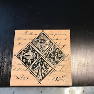 May include: A wooden stamp with a black and white design of four overlapping squares. The squares contain intricate patterns and the text "M Marie de falutans, Anim C Maire Cullivan et J. ad Duss Ci 855- "