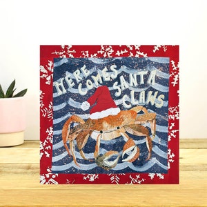 Aquí viene la tarjeta navideña Santa Claws de Port and Lemon