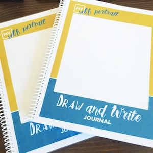 May include: Two spiral bound journals with yellow and blue covers. The top cover has the text "My Self Portrait" and the bottom cover has the text "Draw and Write Journal".