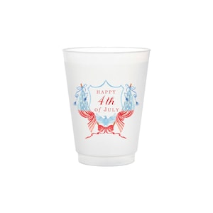 May include: White plastic cup with a red, white, and blue design. The design features a shield with the text "Happy 4th of July".