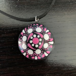 Rock mandala necklace with black cord chain.  16 in with 3 in extender