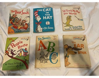 May include: A collection of six vintage children's books, including "The Bear Scouts", "The Cat in the Hat", "I'll Teach My Dog 100 Words", "In a People House", "Dr. Seuss's ABC", and "The Ear Book".