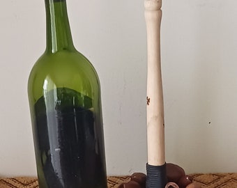 seed pod rattle with wooden handle