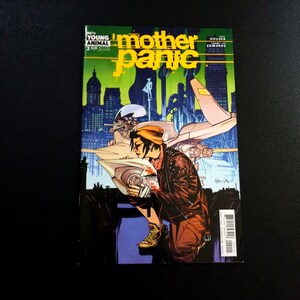 May include: A comic book cover for "Mother Panic" features a figure in a brown jacket and orange beanie, holding a cup. The title is in yellow, with a cityscape background. The DC Young Animal logo is visible.