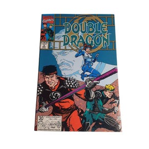 May include: A vintage comic book titled "Double Dragon" by Marvel Comics. The cover features action-packed illustrations of characters in vibrant colors. The comic book is a 30th-anniversary edition from 1961-1991, with the Fantastic Four logo.