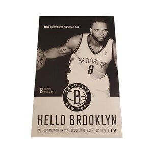 May include: Black and white promotional poster featuring basketball player Deron Williams in a Brooklyn Nets jersey. The poster includes the text "HELLO BROOKLYN" and the team logo. The phrase "BIG DOESN'T NEED FLASHY COLORS" is also present.