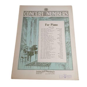 May include: Vintage sheet music titled "CONCERT NUMBERS" for piano. The cover features an illustration of a pianist and violinist. The text includes a list of musical pieces and the publisher's information.