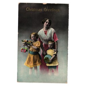 Antike Weihnachtsgruß-Postkarte mit Familien-Illustrations-Ein-Cent-Stempel
