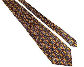 May include: A patterned necktie with a repeating floral design in shades of yellow, blue, and burgundy. The tie is angled, showing its full length and intricate pattern. The background is plain white.