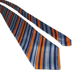 May include: A blue, orange, and white striped tie. The tie has vertical stripes in shades of blue, orange, and white. The tie is made of a shiny material and is angled across a white background.