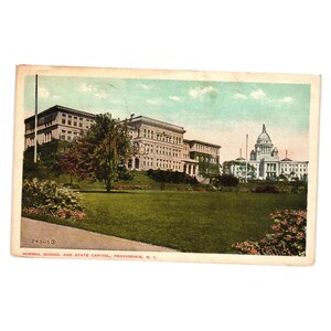 May include: Vintage postcard featuring Normal School and State Capitol in Providence, R.I. The image shows a large building on a hill, a grassy lawn, and a capitol building in the background. The postcard has a white border and the text "24505 S" and "NORMAL SCHOOL AND STATE CAPITOL, PROVIDENCE, R. I."