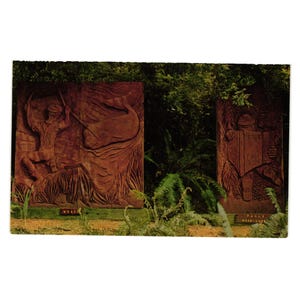 May include: A vintage postcard featuring two large, carved wooden panels. The left panel depicts a whale and a figure, while the right panel shows a person reading a book. The text "WHALE" and "PAUL'S BOOK SHOP" are visible.