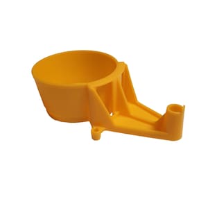 May include: A bright yellow plastic tool with a cup-shaped receptacle and a supporting arm. The tool has a cylindrical opening on the arm's end. The design suggests it is for holding or guiding an object.