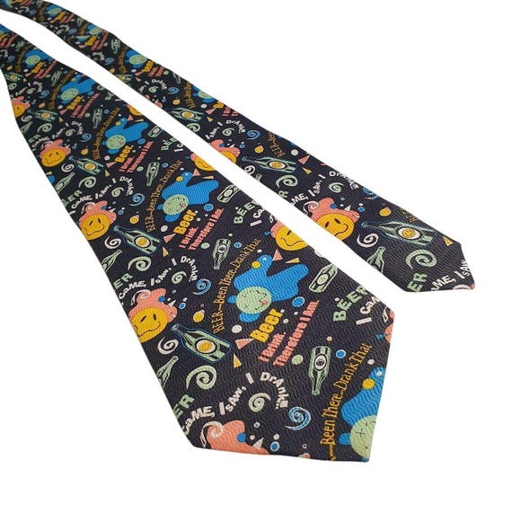 A handmade silk tie with a beer-themed 'Came, Saw, Drank' print — genuinely wearable humor that signals craft over commodity.