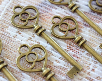 50 pcs Antique Brass Double sided skeleton Key Charm Steampunk Supplies Wedding Key