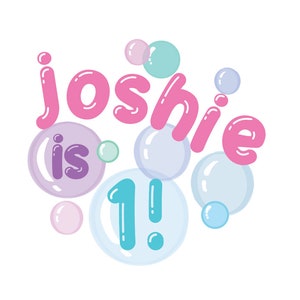 May include: Pink and blue bubble-themed graphic with the text "Joshie is 1!" surrounded by colorful bubbles.