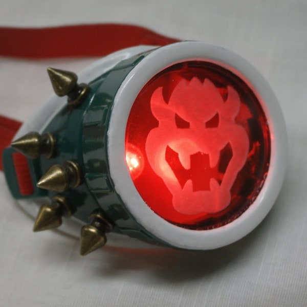 Wicked Bowser Inspired Monogoggle - Lights up, laser ethced lens, hand painted, brass spikes, red strap, cosplay accessory