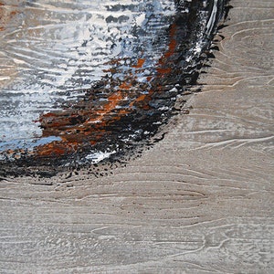 May include: Abstract painting with textured brushstrokes. The artwork features a blend of colors, including black, brown, white, and blue, against a neutral beige background. The composition has a dynamic, layered effect, suggesting depth and movement.