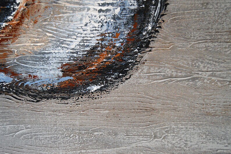 May include: Abstract painting with textured brushstrokes. The artwork features a blend of colors, including black, brown, white, and blue, against a neutral beige background. The composition has a dynamic, layered effect, suggesting depth and movement.
