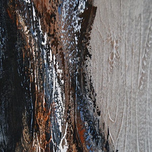 May include: Abstract painting with a textured surface. The artwork features a blend of dark brown, black, white, and blue hues, with a light beige area on the right side. The paint is applied in thick strokes.