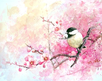 May include: A watercolour painting of a small bird perched on a branch of a flowering tree. The bird is white with a black head and is surrounded by pink blossoms. The background is a soft wash of pink and yellow.