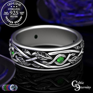 Puede incluir: Un anillo de plata de ley con un diseño celta. El anillo presenta un patrón de hojas y vides con piedras preciosas verdes. El anillo está marcado "925 Silver" y "Made in the USA". El anillo es libre de níquel.