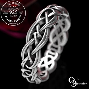 May include: A sterling silver ring featuring an intricate, continuous woven knot pattern. A circular emblem in the upper left corner reads Genuine Sterling 925 Silver, hand crafted, nickel free, made in the USA. The text Celtic Eternity is in the bottom right.